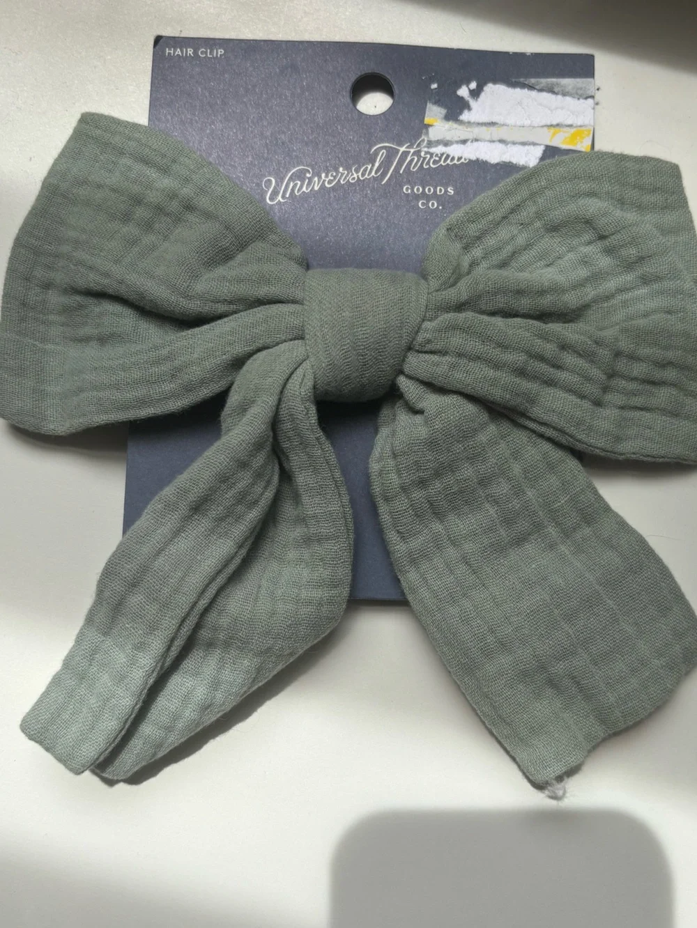 NWT large sage green hair bow of muslin fabric on silver clip, one size